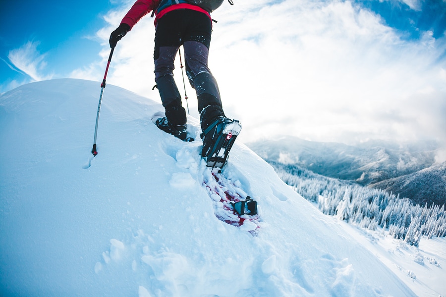 snowshoeing up a snowy hill