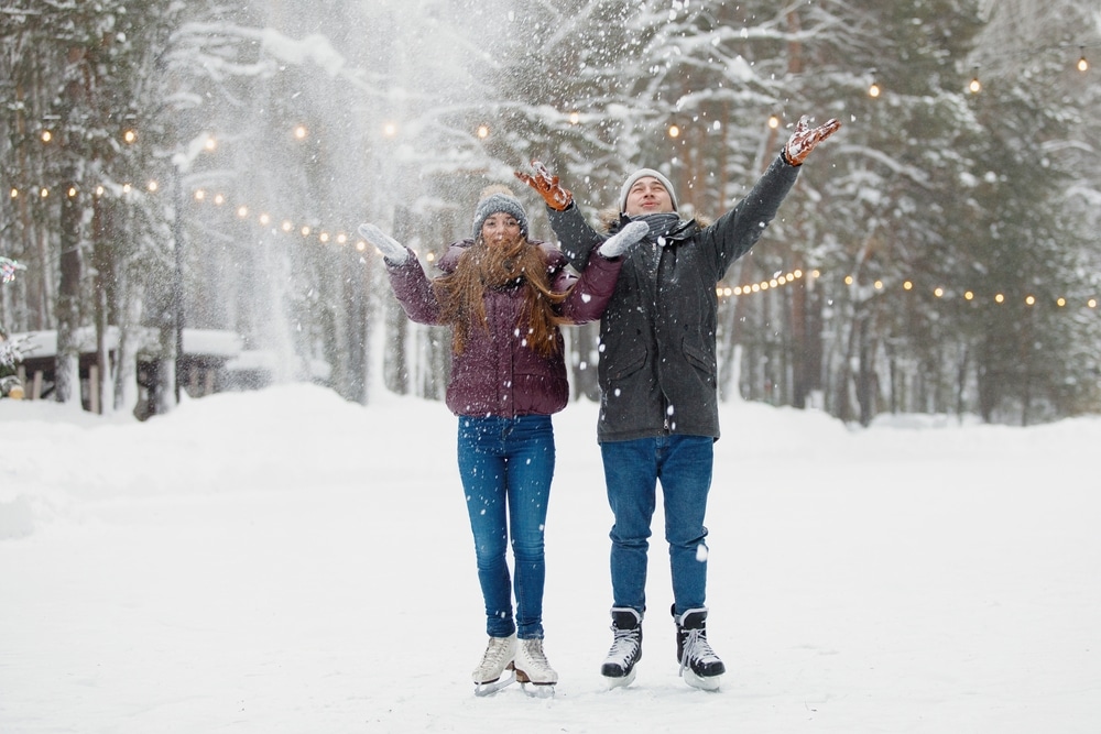 Things to do in New Hampshire this winter, cute couple at an ice skating rink 
