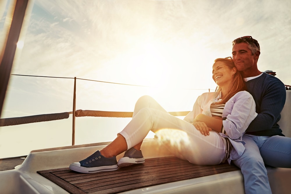 Things to do in the Lakes Region NH, photo of a couple on a boat