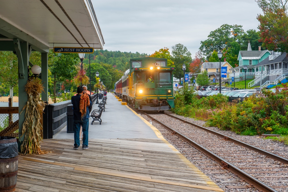 People waiting at the station to ride the Winnipesaukee Scenic Railroad in the fall